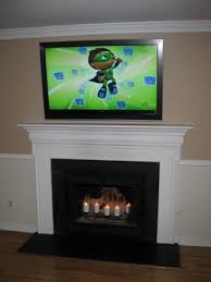 TV mounted above fireplace